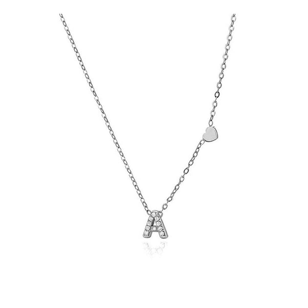 Collar inicial con circonitas y corazón de acero inoxidable plateado - Keoki Shop